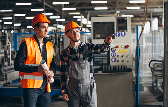 two colleagues factory 1 e1645864592179